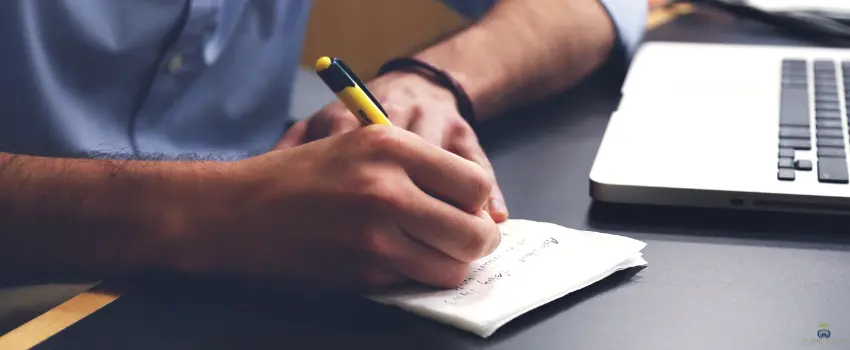SJI-Man Writing on Notebook